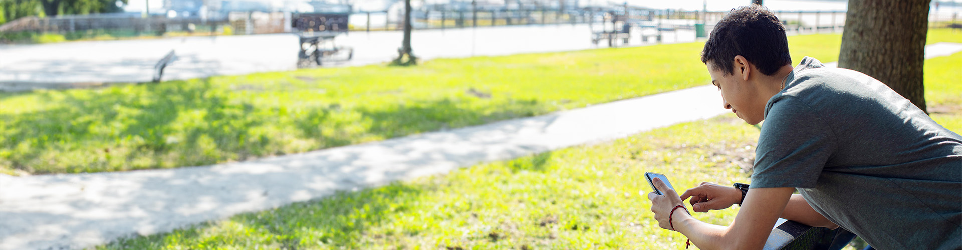 young man using a mobile phone outdoors