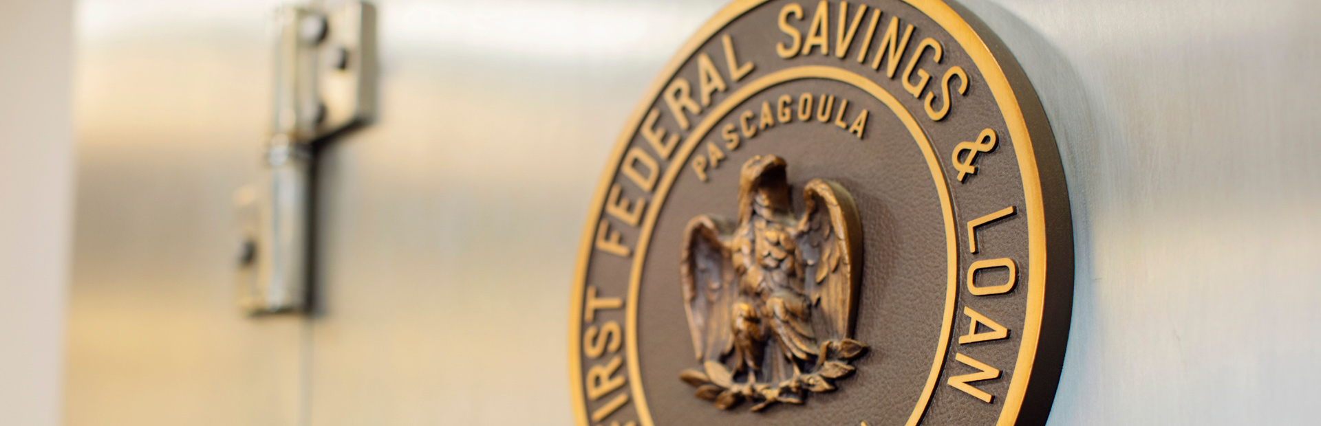 Close-up of the First Federal Savings & Loan seal on a vault